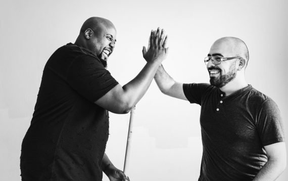 Men giving each other a high five